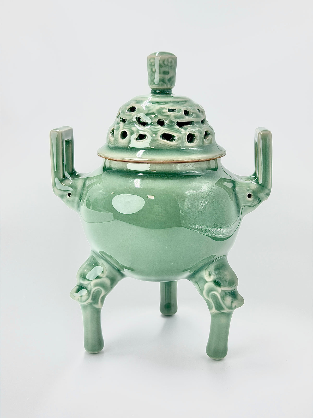 Longquan celadon tripod incense burner in antique bronze style