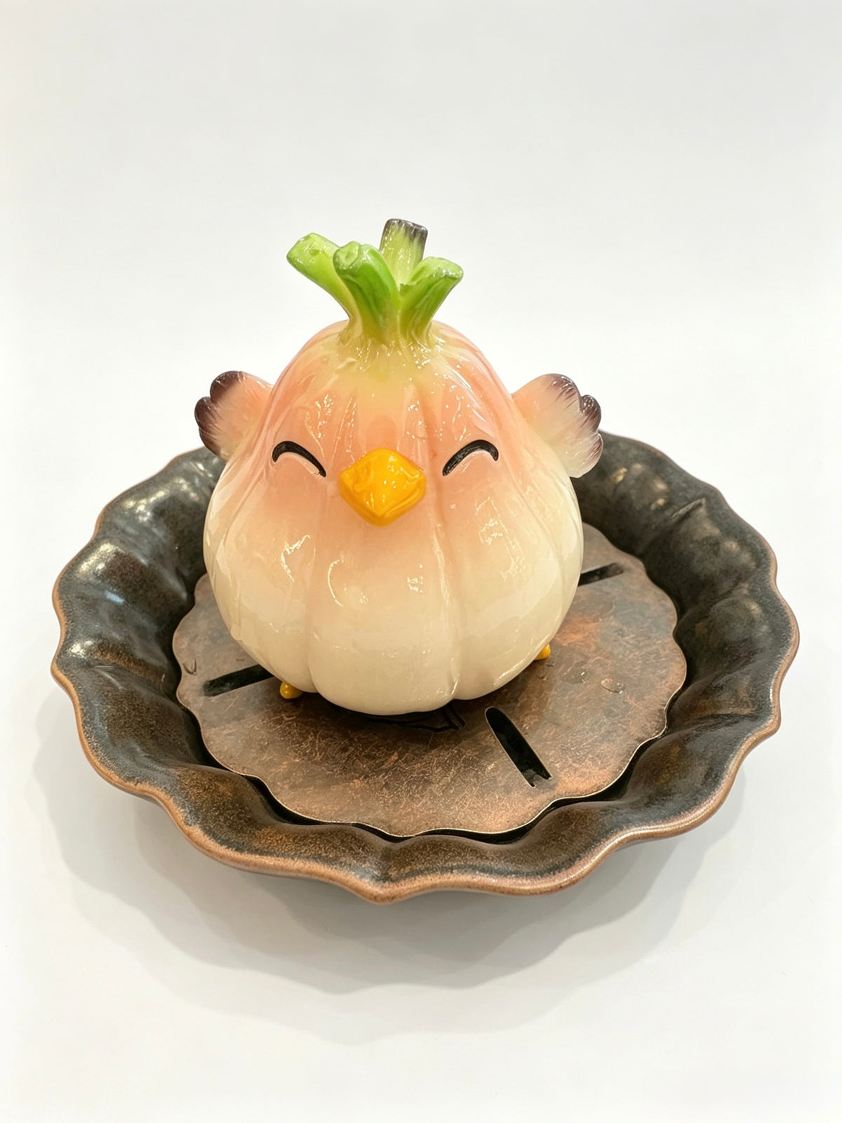 Garlic bird turning into a pink tea pet